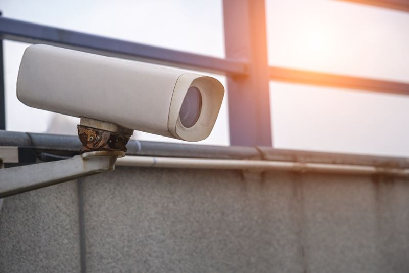 A wireless security camera on a wall.